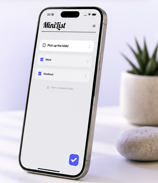MiniList app running on a standing iPhone on a calm desk